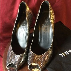 Chanel snakeskin pumps.